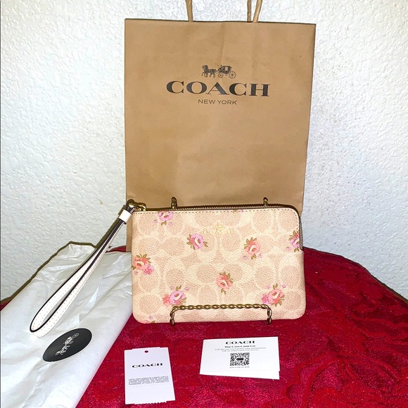 Coach Handbags - COACH Floral Beige Wristlet